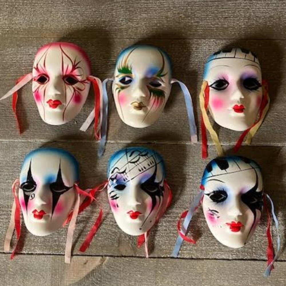 Six wall hanging clay masks